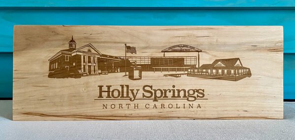 engraved Holly Springs skyline on wood block